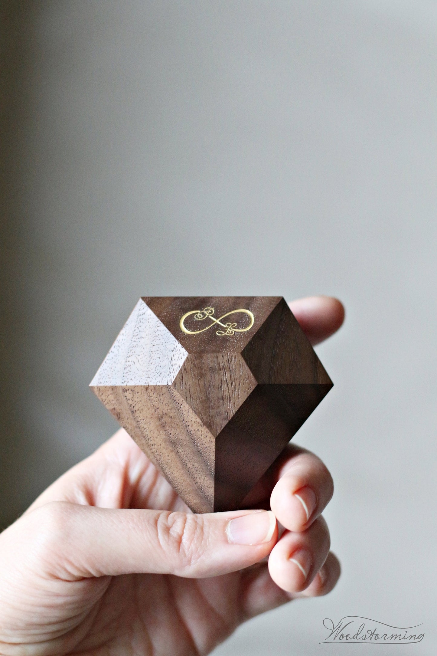 Rotating diamond shape walnut wood ring box by Woodstorming